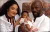 IsaacandWifewith14thchild.JPG